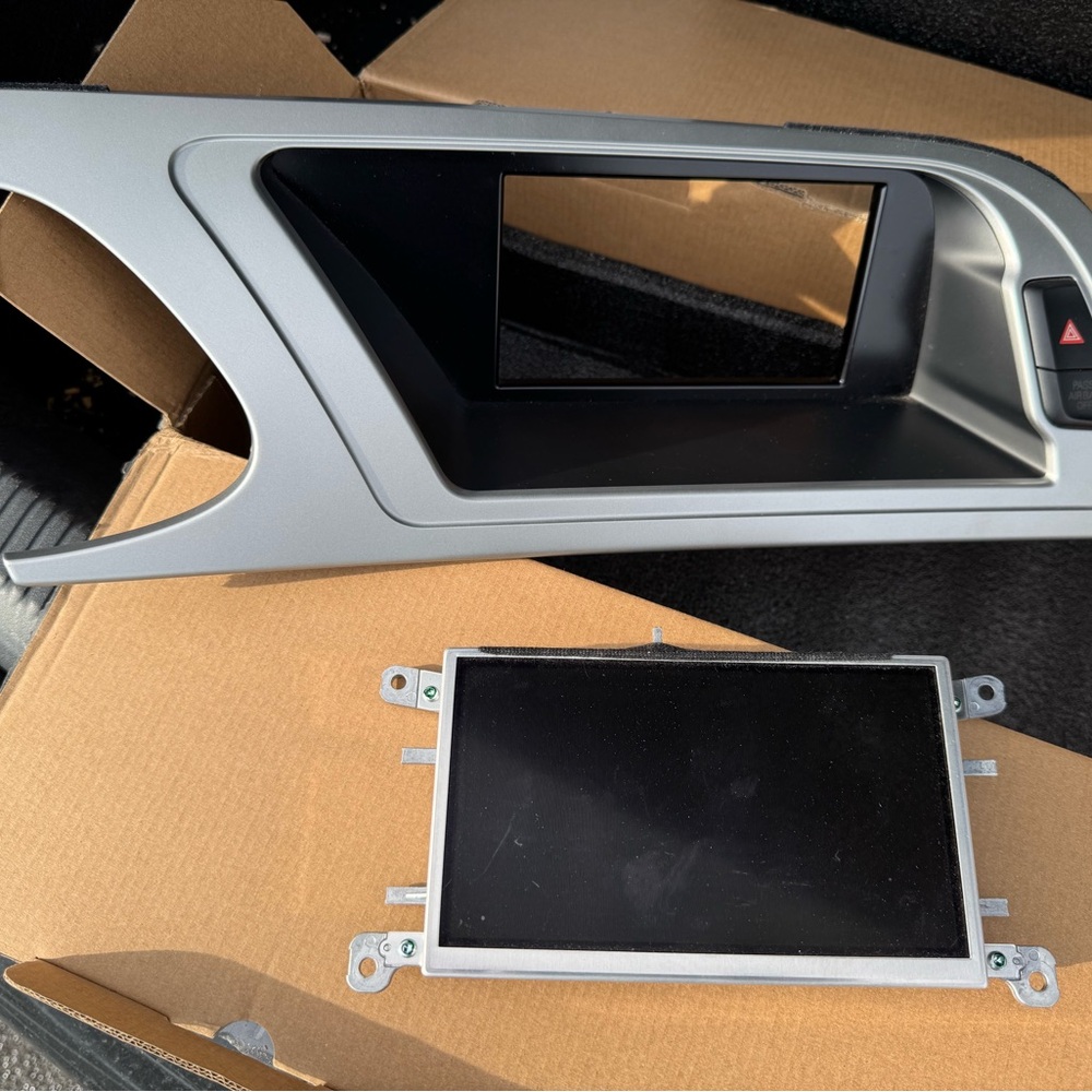 OEM Audi A4 factory radio screen and bezel